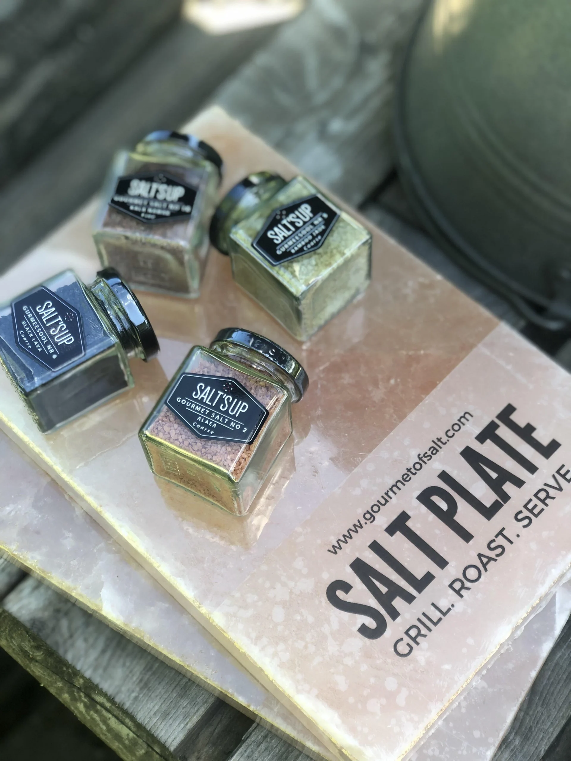 Salt'sUp gourmet salt jars on a Himalayan salt plate